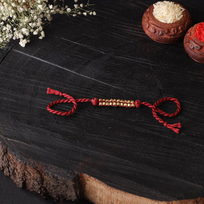 Handcrafted tribal dokra brass thread rakhi 43