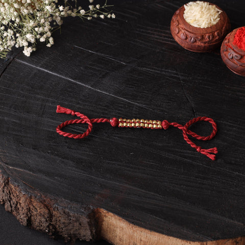 Handcrafted tribal dokra brass thread rakhi 43
