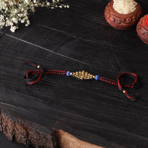 Handcrafted tribal dokra brass thread rakhi 44