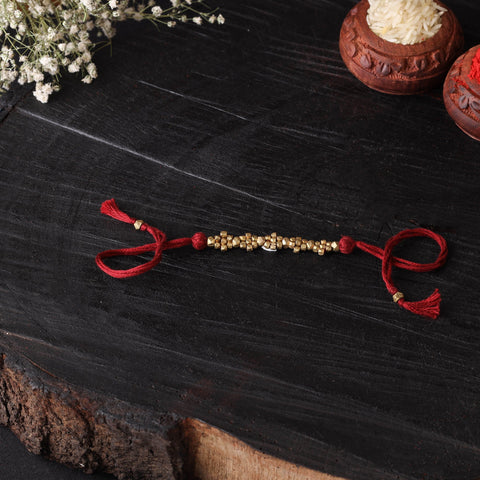 Handcrafted tribal dokra brass thread rakhi 45