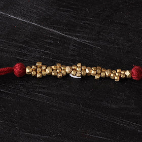Handcrafted tribal dokra brass thread rakhi 45