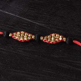 Handcrafted tribal dokra brass thread rakhi 46
