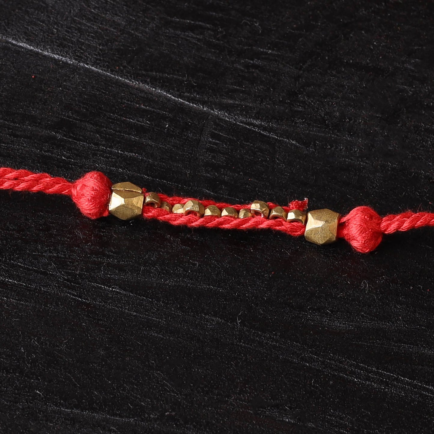 Handcrafted tribal dokra brass thread rakhi 47