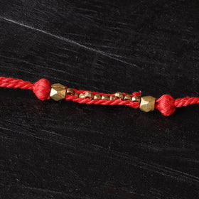 Handcrafted tribal dokra brass thread rakhi 47