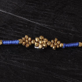 Handcrafted tribal dokra brass thread rakhi 51