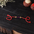 Handcrafted tribal dokra brass thread rakhi 52