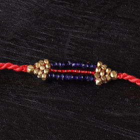 Handcrafted tribal dokra brass thread rakhi 52
