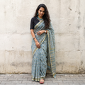 Blue Sanganeri hand block print Kota Doria cotton saree by artisan Purushottam Chhipa, draped and worn by a woman, AI visual of the saree, iTokri