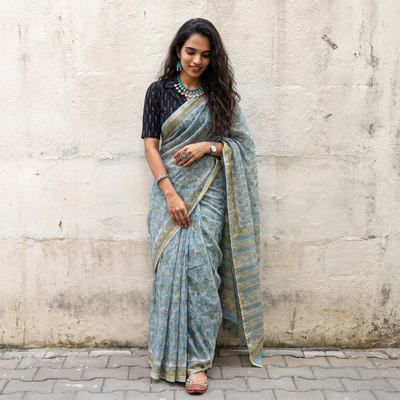 Blue Sanganeri hand block print Kota Doria cotton saree by artisan Purushottam Chhipa, draped and worn by a woman, AI visual of the saree, iTokri