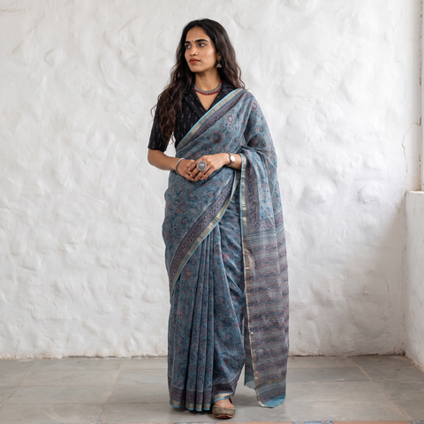 Grey blue Sanganeri hand block print Kota Doria cotton saree by artisan Purushottam Chhipa, draped and worn by a woman, AI visual of the saree, iTokri
