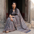 Grey Sanganeri hand block print Kota Doria cotton saree by artisan Purushottam Chhipa, draped and worn by a woman, AI visual of the saree, iTokri
