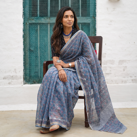 Blue grey Sanganeri hand block print Kota Doria cotton saree by artisan Purushottam Chhipa, draped and worn by a woman, AI visual of the saree, iTokri