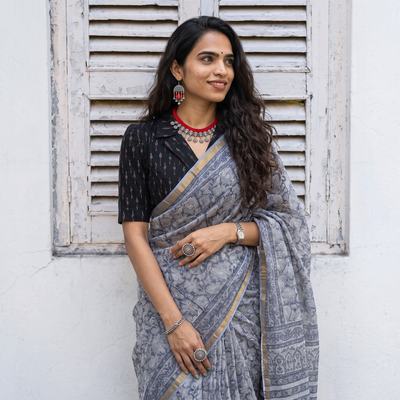 Grey Sanganeri hand block print Kota Doria cotton saree by artisan Purushottam Chhipa, draped and worn by a woman, AI visual of the saree, iTokri