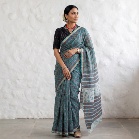 Teal Sanganeri hand block print Kota Doria cotton saree by artisan Purushottam Chhipa, draped and worn by a woman, AI visual of the saree, iTokri