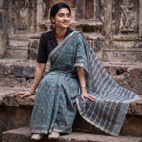 Teal grey Sanganeri hand block print Kota Doria cotton saree by artisan Purushottam Chhipa, draped and worn by a woman, AI visual of the saree, iTokri