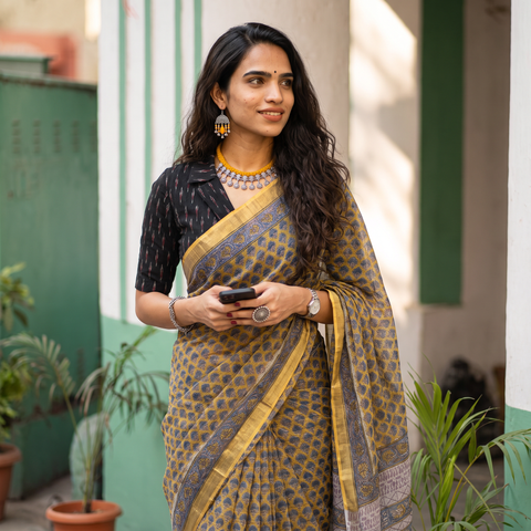 Mustard and grey Sanganeri hand block print Kota Doria cotton saree by artisan Purushottam Chhipa, draped and worn by a woman, AI visual of the saree, iTokri