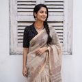 Beige Sanganeri hand block print Kota Doria cotton saree by artisan Purushottam Chhipa, draped and worn by a woman, AI visual of the saree, iTokri