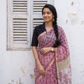 Pink Sanganeri hand block print Kota Doria cotton saree by artisan Purushottam Chhipa, draped and worn by a woman, AI visual of the saree, iTokri