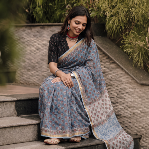 Grey blue Sanganeri hand block print Kota Doria cotton saree by artisan Purushottam Chhipa, draped and worn by a woman, AI visual of the saree, iTokri