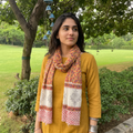 Peach Sanganeri Hand Block Print Pure Merino Wool Stole, worn by a woman, AI visual of the stole, iTokri