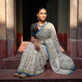 Cream and blue Sanganeri hand block print pure mul cotton ready to wear saree, draped and worn by a woman, AI visual of the saree, iTokri
