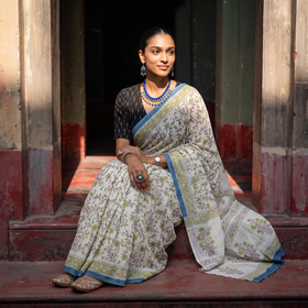 Cream and blue Sanganeri hand block print pure mul cotton ready to wear saree, draped and worn by a woman, AI visual of the saree, iTokri