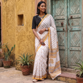 White and yellow Sanganeri hand block print pure mul cotton ready to wear saree, draped and worn by a woman, AI visual of the saree, iTokri