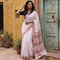 White and pink Sanganeri hand block print pure mul cotton ready to wear saree, draped and worn by a woman, AI visual of the saree, iTokri
