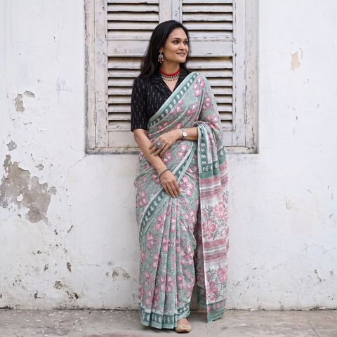 Mint green and pink Sanganeri hand block print pure mul cotton ready to wear saree, draped and worn by a woman, AI visual of the saree, iTokri