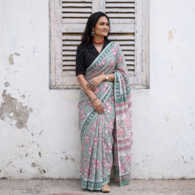 Mint green and pink Sanganeri hand block print pure mul cotton ready to wear saree, draped and worn by a woman, AI visual of the saree, iTokri