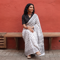 White and black Sanganeri hand block print pure mul cotton ready to wear saree, draped and worn by a woman, AI visual of the saree, iTokri