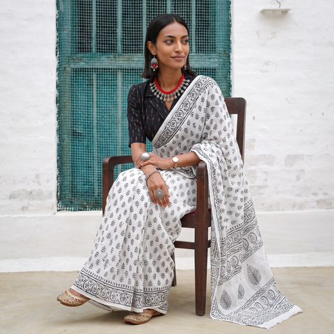 White and black Sanganeri hand block print pure mul cotton ready to wear saree, draped and worn by a woman, AI visual of the saree, iTokri
