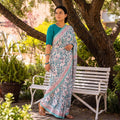 White and Teal Sanganeri Hand Block Print Pure Mul Cotton Ready To Wear Saree, draped and worn by a woman, AI visual of the saree, iTokri