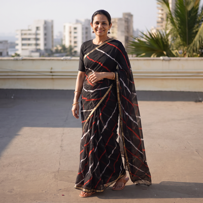 Black Shibori Tie-Dye Kota Doria Cotton Saree, draped and worn by a woman, AI visual of the saree, iTokri