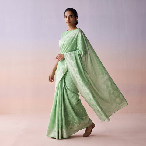 Green Silk Cotton Cutwork Buti Banarasi Saree, draped and worn by a woman, AI visual of the saree, iTokri