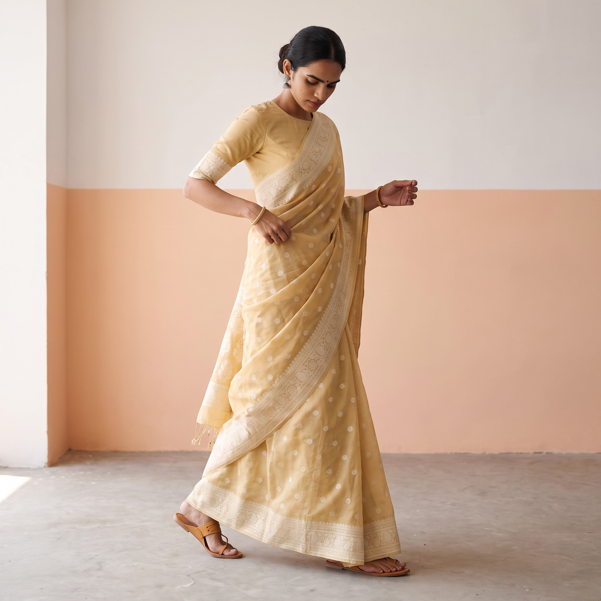 Yellow Silk Cotton Cutwork Buti Banarasi Saree, draped and worn by a woman, AI visual of the saree, iTokri