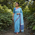 Sky Blue Silk Cotton Thread Buti Assam Pure Handwoven Saree with Blouse Piece, draped and worn by a woman, AI visual of the saree, iTokri