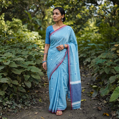 Sky Blue Silk Cotton Thread Buti Assam Pure Handwoven Saree with Blouse Piece, draped and worn by a woman, AI visual of the saree, iTokri