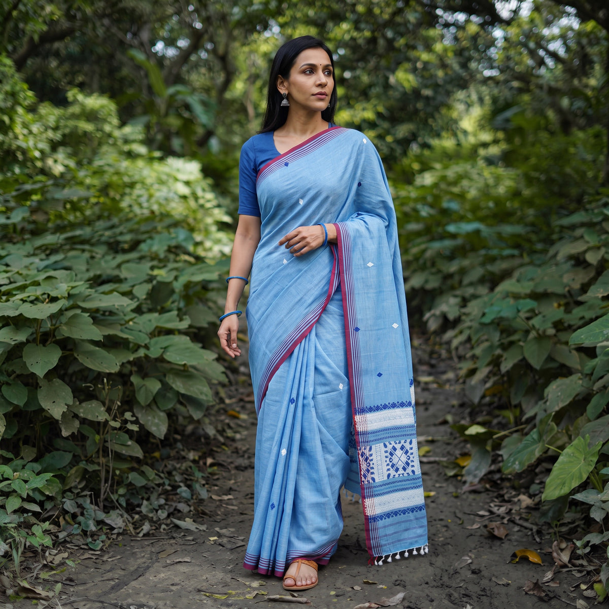 Sky Blue Silk Cotton Thread Buti Assam Pure Handwoven Saree with Blouse Piece, draped and worn by a woman, AI visual of the saree, iTokri