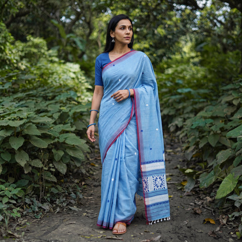 Sky Blue Silk Cotton Thread Buti Assam Pure Handwoven Saree with Blouse Piece, draped and worn by a woman, AI visual of the saree, iTokri