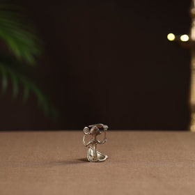 Sitting lady with combing hair tribal odisha dokra art