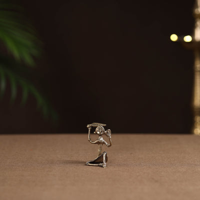 Sitting lady with combing hair tribal odisha dokra art