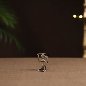 Sitting lady with combing hair tribal odisha dokra art