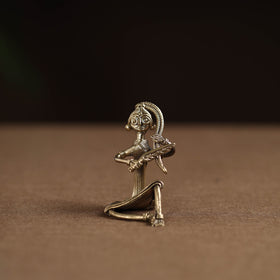 Sitting lady with combing hair tribal odisha dokra art