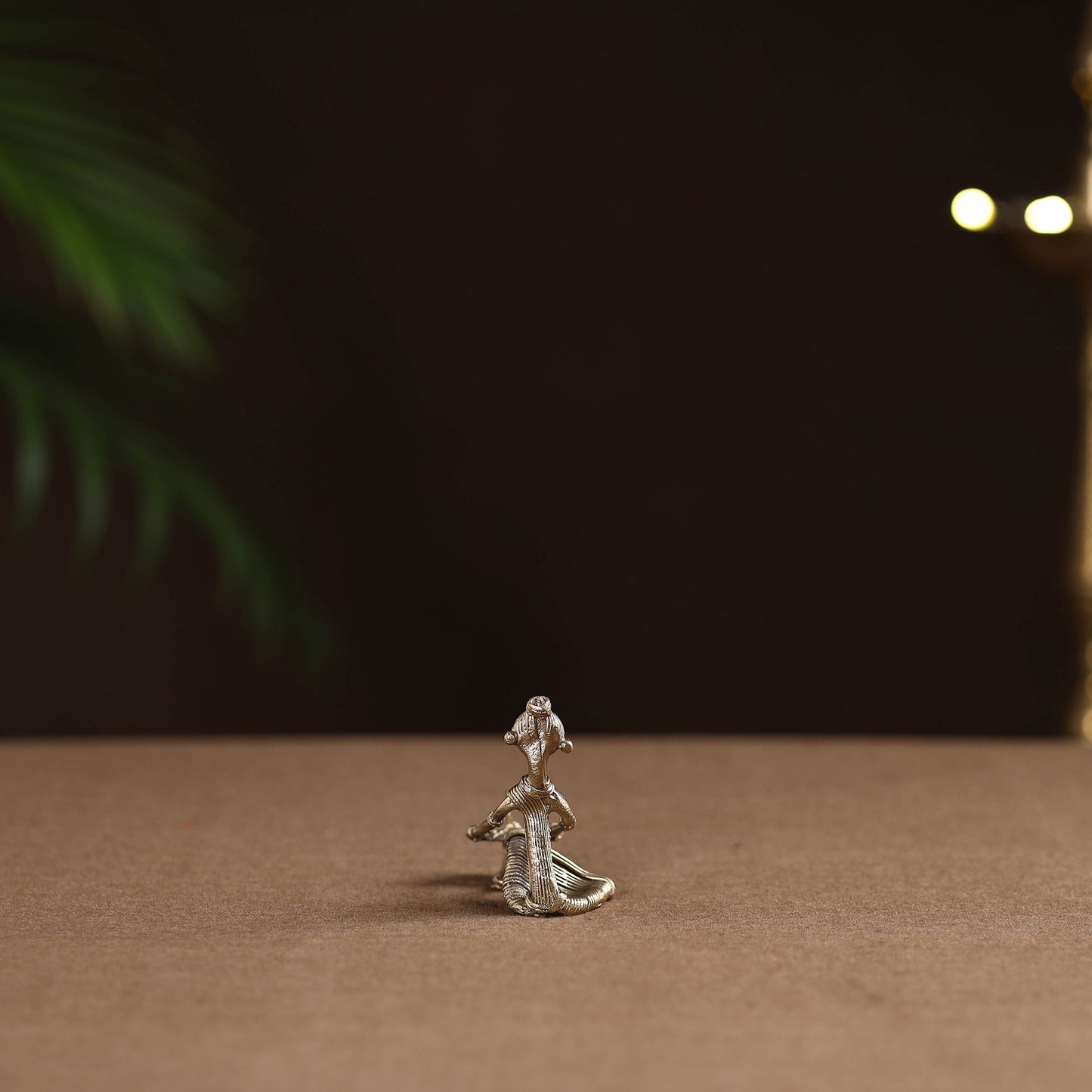 Sitting lady with cutting fish tribal odisha dokra art