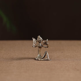 Sitting lady with reading book tribal odisha dokra art