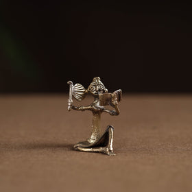 Sitting lady with reading book tribal odisha dokra art