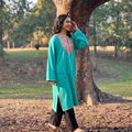 Green Sozni Hand Embroidered Kashmiri Merino Wool Pheran, worn by a model, AI visual of the pheran, iTokri