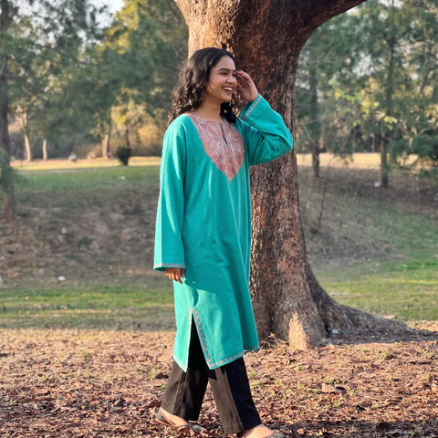 Green Sozni Hand Embroidered Kashmiri Merino Wool Pheran, worn by a model, AI visual of the pheran, iTokri