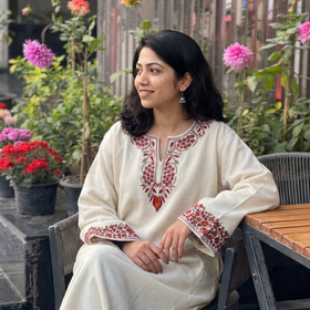 White Sozni Hand Embroidered Kashmiri Merino Wool Pheran, worn by a model, AI visual of the pheran, iTokri